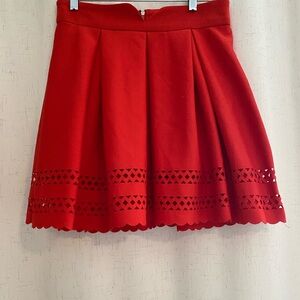 Vibrant Red Mini A-Line Skirt with Pleated Cutout Design